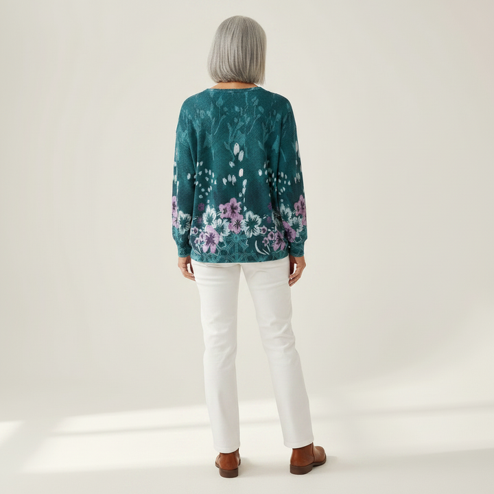 Yolande – Türkise Pulli mit Blüemli