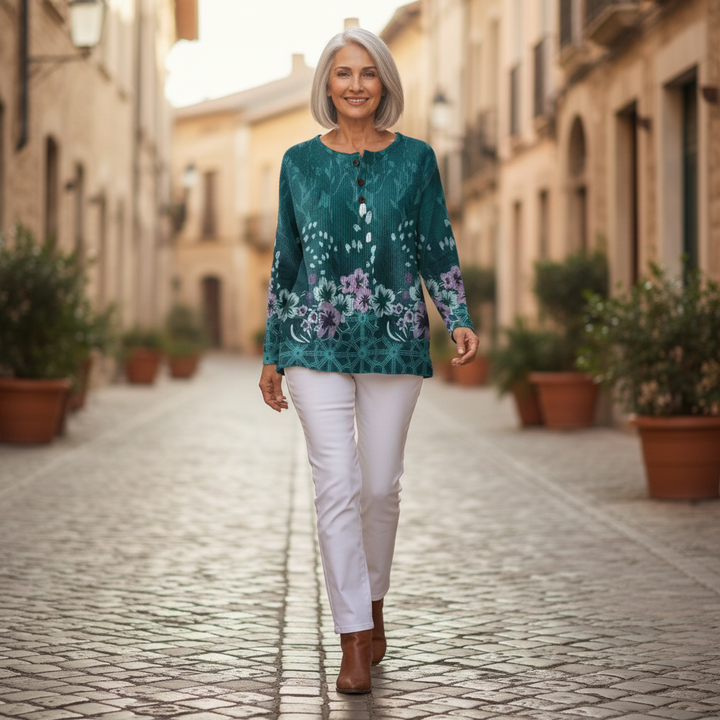 Yolande – Türkise Pulli mit Blüemli