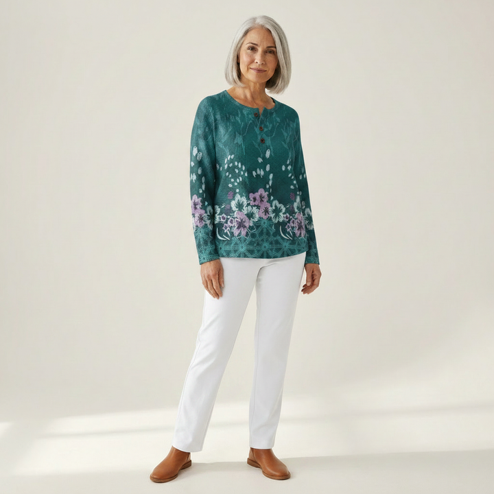 Yolande – Türkise Pulli mit Blüemli