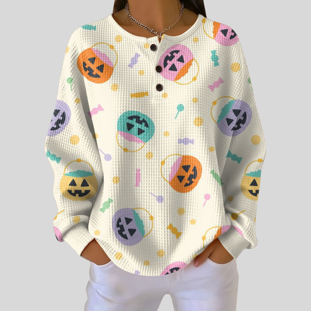 Léonie – Crèmefarbige Pulli mit Halloween-Chürbisse