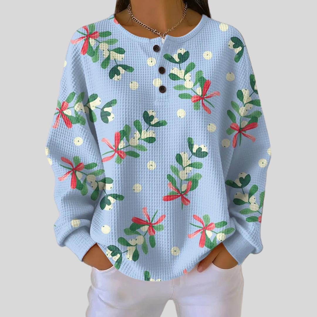 Roseline – Himmelblauer Pullover mit Mistelzweigen